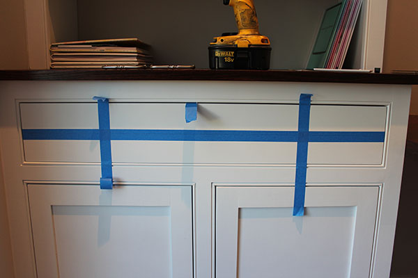 painters tape on cabinet